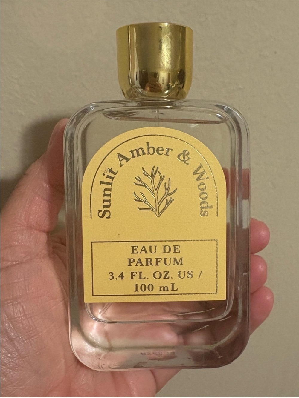 Sunlit Amber & Woods Eau de Parfum — Yellow Bottle Label